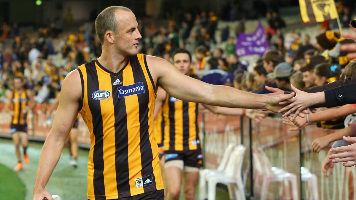David Hale of the Hawks high fives fans after playing his 200th game. The Hawks defeated the visiting Dockers 137-79. Picture: Getty Images