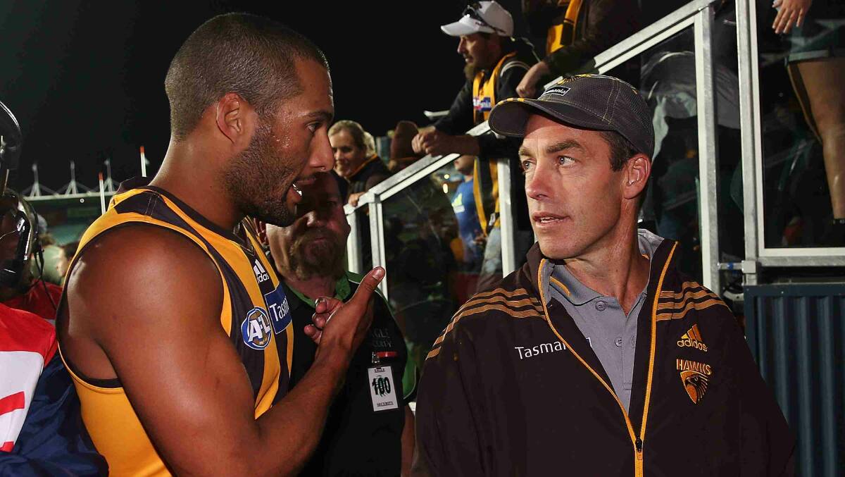 Hawks coach Alastair Clarkson talks with Josh Gibson after their win in the round two AFL NAB Challenge match between the Hawthorn Hawks and the North Melbourne Kangaroos at Aurora Stadium. Picture: Getty Images
