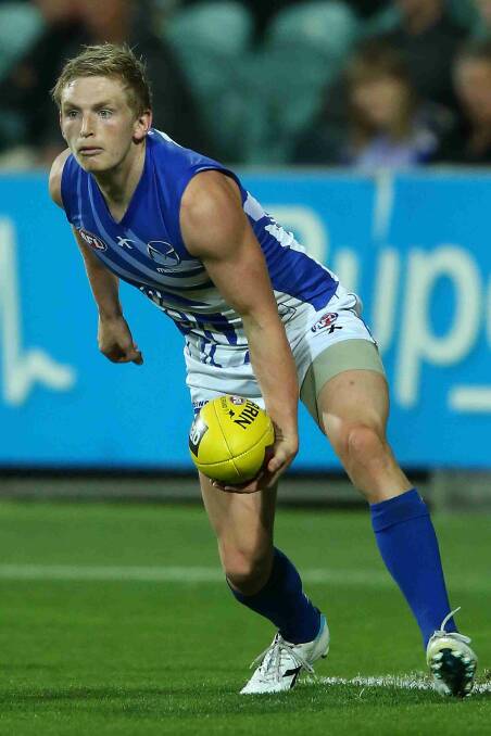 Jack Ziebell of the Kangaroos handpasses the ball during the round two AFL NAB Challenge match between the Hawthorn Hawks and the North Melbourne Kangaroos. Picture: Getty Images