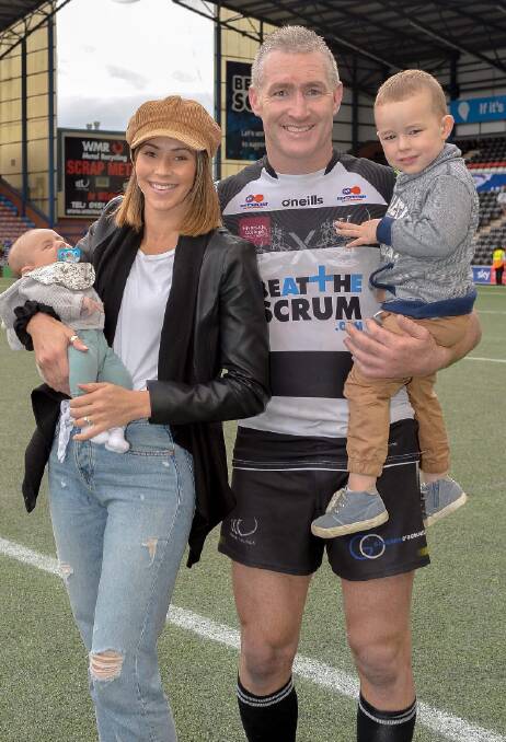 HOMETOWN HERO: Chris Houston with his wife Amy and their two sons Kai and Harvey after a game in England. Photo: Provided.