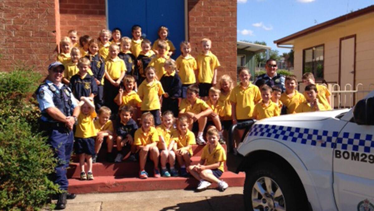 Students got to inspect the police vehicle during the visit to the school by Bombala constables Nathan Marks and Steven Gay.