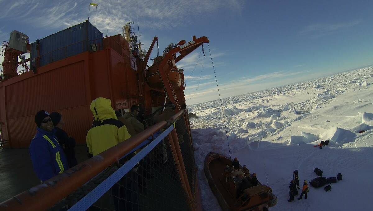 MALUA BAY: Malua Bay's Darcy Chalker is chief steward aboard the Aurora Australis, which rescued a stranded Russian ship in the Antartica. He snapped this shot of stranded passengers being winched aboard.
