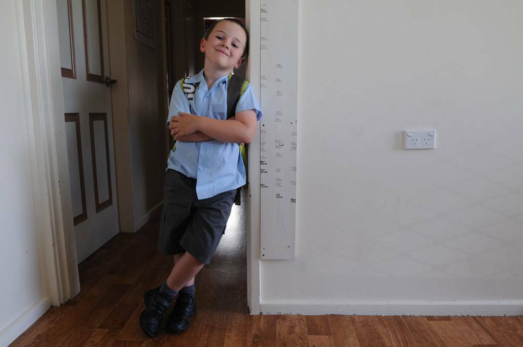 Zachary Howarth gets ready for his first day of school. Photo: STEVE GOSCH, Central Western Daily.