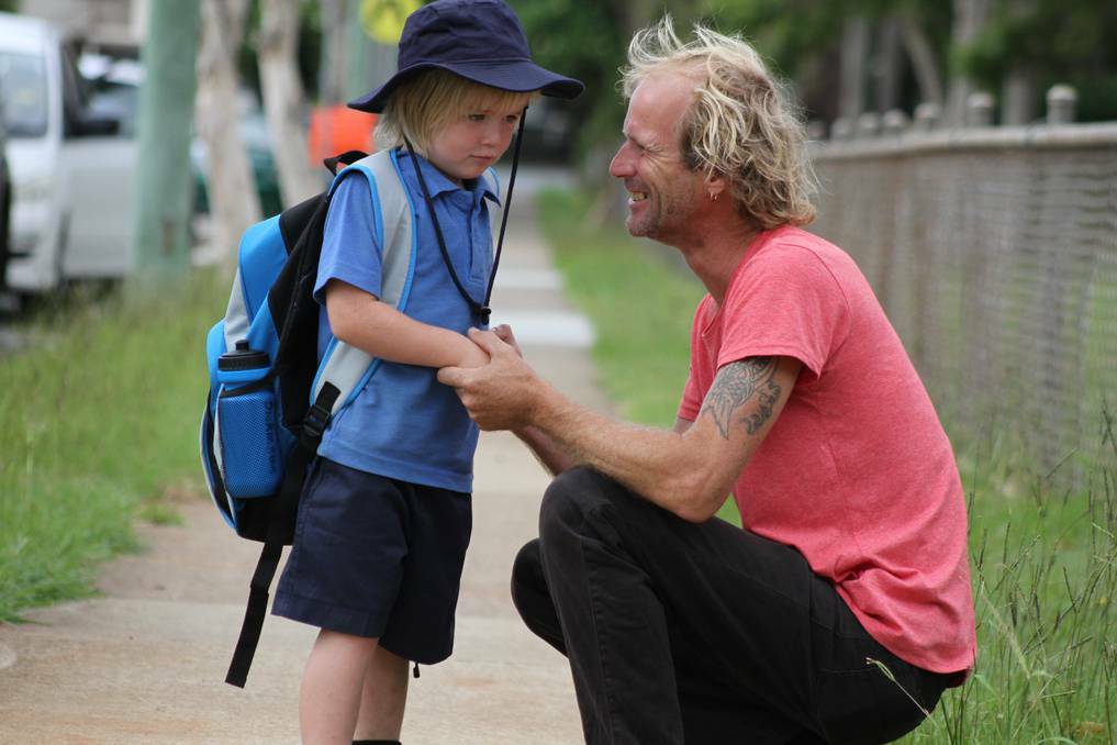 Tony Dickinson gives his son Gabriel, 5 of Lamb Island an emotional farewell on his first day at Victoria Point State School. Pic: Chris McCormack, Bayside Bulletin.