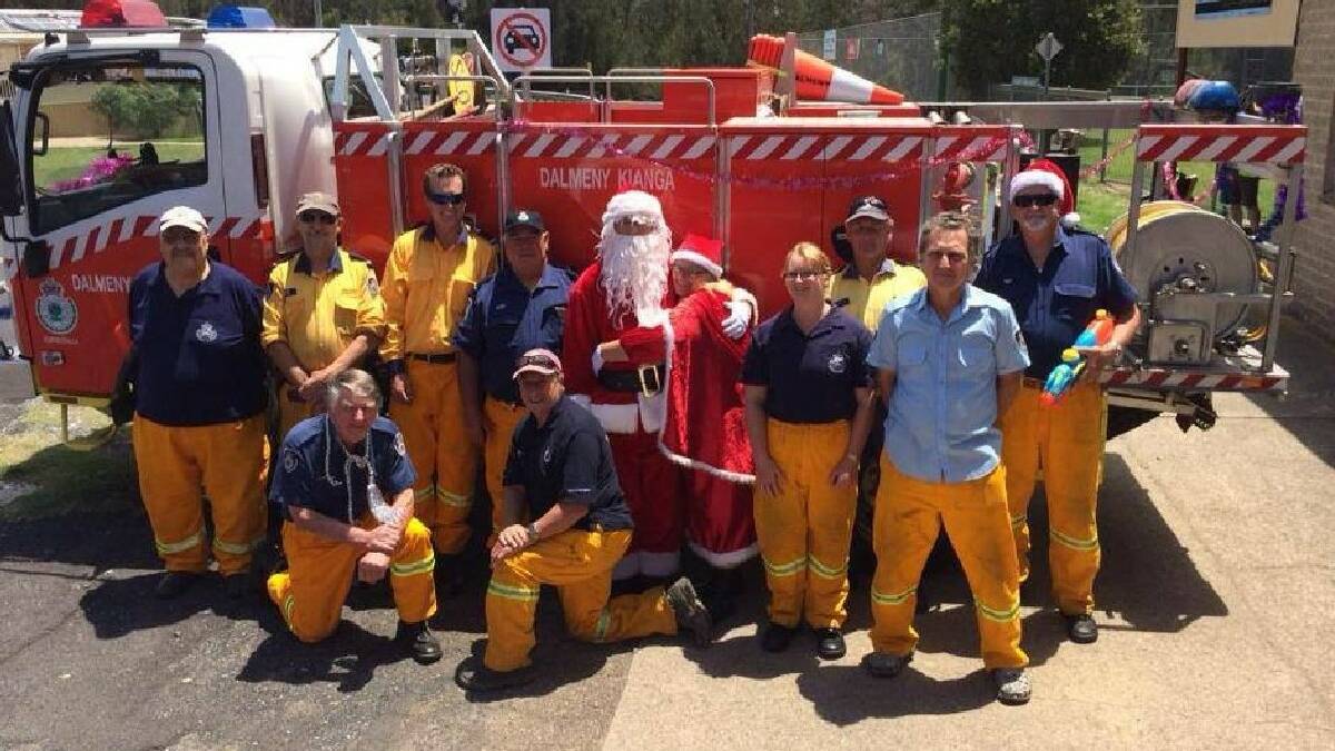DALMENY: The Dalmeny-Kianga RFS   brigade threw out an amazing 50kg of   lollies over Christmas and captain   Greg Hill, pictured in the Santa suit   with Mrs Claus, thanked the community   for all their support.  