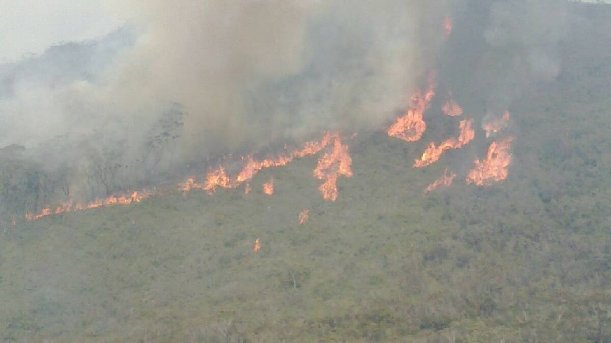  ULLADULLA: A large bushfire continues to burn in the rugged and inaccessible Wirritin Ridge area of the Budawang National Park, about 35km west of Ulladulla.