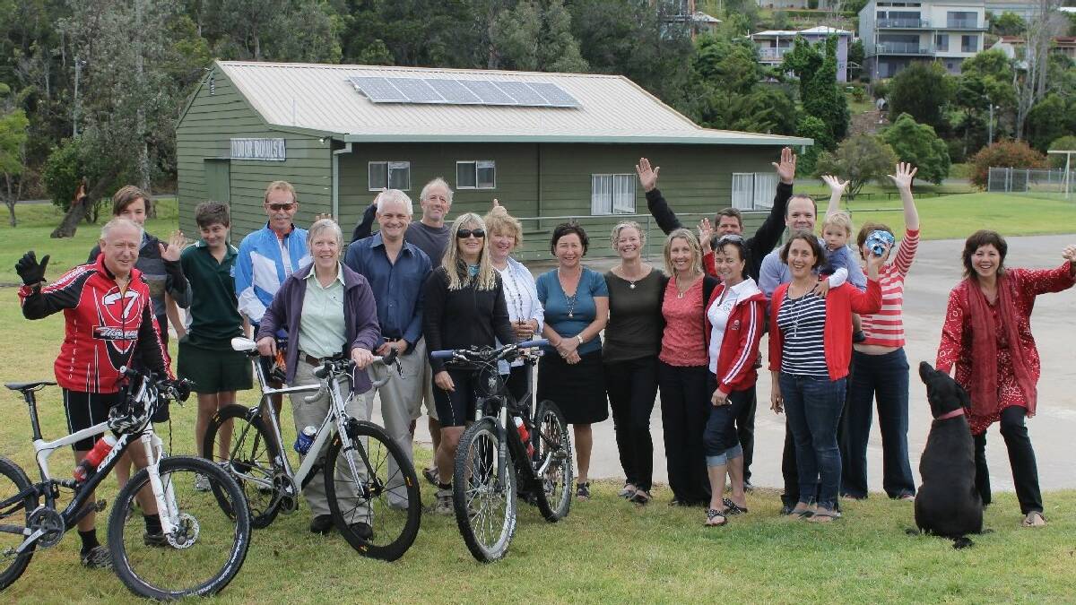 TATHRA: Representatives from Clean Energy For Eternity and Tathra Mountain Bike Club, along with   excited community members, celebrate the solar panel installation on Tathra’s Green Shed, meaning every   community building in town is now powered by the sun.