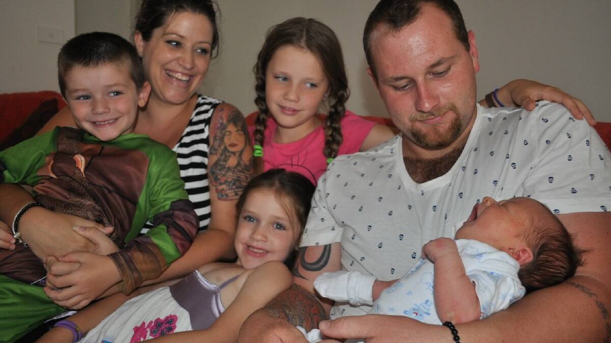 ULLADULLA: Mia, Jayda, Emma and Toby   Harris with Harley Trinder and new   addition to the family, baby Kai, who   was the first baby of the year born   at Milton Hospital.